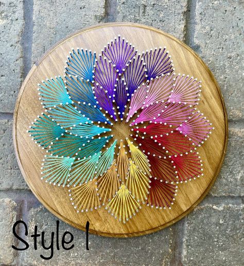 "Vibrant colors make this mandala design really pop!  Made on a 12\" round wood piece. Choose from designs and colors pictured, or leave a note to customize your own geometric mandala colors! Sawtooth hanger attached on back." Mandala String Art, Feather String Art, فن الرسم بالمسامير, Art Fil, String Art Templates, String Art Tutorials, String Wall Art, Nail String Art, Boho Art Drawings