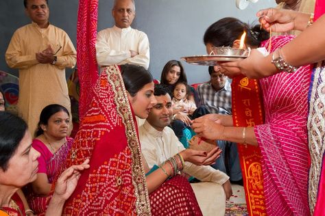 “Gol Dhana” – Engagement Ceremony for Gujarati Couples     The Gujarati Engagement ceremony is called “Gol Dhana” (or “Gor Dhana”). This means Coriander Seeds and Jaggery. Both these ingredients are distributed at a Gujarathi Engagement. For the engagement, the bride-to-be and her family visits the groom-to-be’s house with sweets and gifts. The couple exchange rings. The couple seek the blessing of 5 married women from both their families. This symbolizes the coming together of both families... Concert Outfit Rock, Outfit Rock, Gujarati Wedding, Mom In Law, Married Women, Wedding Gifts For Bride And Groom, Bridal Boxes, Ring Ceremony, Rings Ceremony