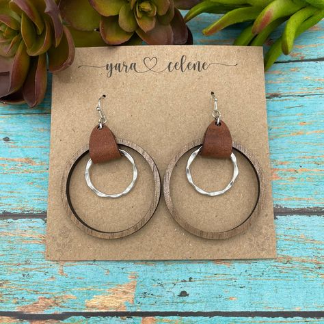 Classy. Simple. Beautiful. These earrings are 1.5" and feature the option of Basswood or Walnut paired with genuine leather and gorgeous silver plated hardware. How To Make Leather, Denim Earrings, Diy Leather Earrings, Laser Engraved Ideas, Jewelry Making Earrings, Simple Leather, Leather Cuts, Wooden Hoop, Wooden Earrings