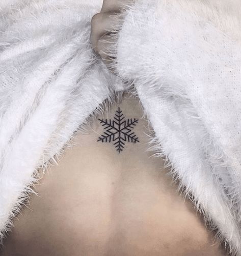 Black snowflake tattoo on the sternum Ice Tattoo, Tramp Stamps, Snowflake Tattoo, Winter Tattoo, Mother Son Tattoos, Snow Flake Tattoo, Son Tattoo, Palm Tattoos, Bone Tattoos