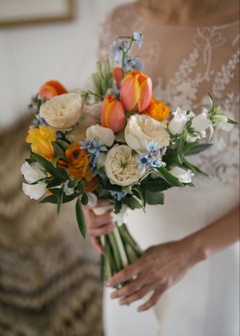 Orange & Blue Bridal Bouquet- Spring 2022 Orange And Blue Wildflower Bouquet, Wedding Bouquet Spring Flowers, Blue Green Orange Bouquet, Blue Orange And Pink Aesthetic, Blue Yellow Pink Wedding Bouquet, Bridal Bouquet With Tulips, Orange Blue Wedding Flowers, May Bridal Bouquets, Blue Orange Bouquet