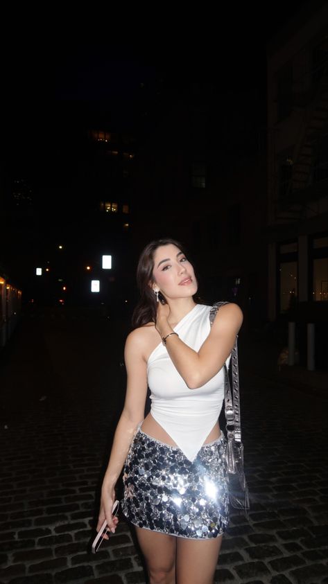 Sparkly Mini Skirt White Top Outfit Inspiration NYC Night outfit Sparkly Set Outfit, Sparkly Club Outfits, Silver Skirt Outfit Party, White Going Out Outfit, Nyc Night Outfit, Sequin Mini Skirt Outfit, Sparkly Skirt Outfit, Sparkly Mini Skirt, White Top Outfit