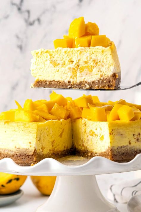 Creamy and luscious Mango Cheesecake is a perfect blend of rich cheese and sweet, fresh mangoes. It's an easy-to-make dessert that promises to be the star of any dining table, offering a delightful taste and irresistible texture. Baked Mango, Mango Desserts, Mango Dessert Recipes, Mango Cheesecake, Mango Dessert, Mango Cake, Easy To Make Desserts, Mango Recipes, Cheesecake Desserts