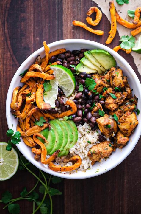 Peruvian Chicken Bowls with Crispy Sweet Potato Fries and Cilantro Aioli. - Wandering chickpea Cilantro Aioli, Oven Baked Sweet Potato Fries, Oven Baked Sweet Potato, Peruvian Chicken, Baked Sweet Potato Fries, Crispy Sweet Potato Fries, Sweet Potato Bowls, Chicken Bowls, Sweet Potato Fries Baked