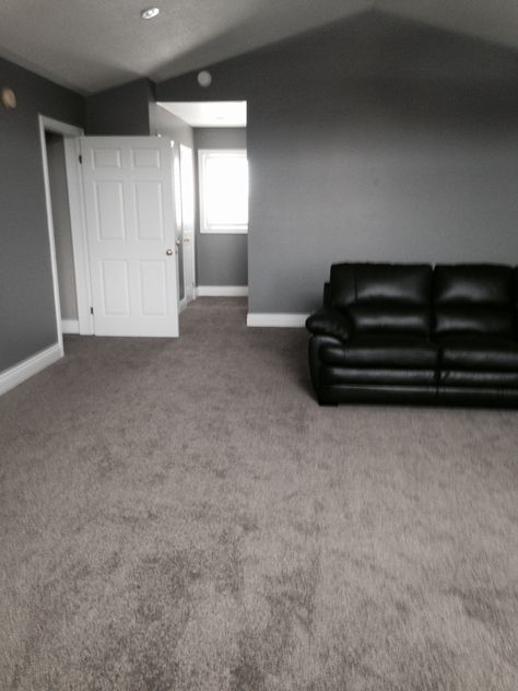 High piled Frise Carpet in a Great Room. - Loving the dark grey carpet with the deep grey walls. Carpeting continues into hallway, bedroom, and stairs. Carpeting was purchased and installed through Floors In Motion Visit our website: www.floorsinmotion.com to learn more about us. 'Like' our page: www.facebook.com/floorsinmotion to keep informed on special offers and promotions. Grey Carpet Living Room, Plastic Carpet, Dark Grey Carpet, Carpet Diy, White Hallway, Dark Carpet, Gray Walls, Carpet Trends, Brown Carpet