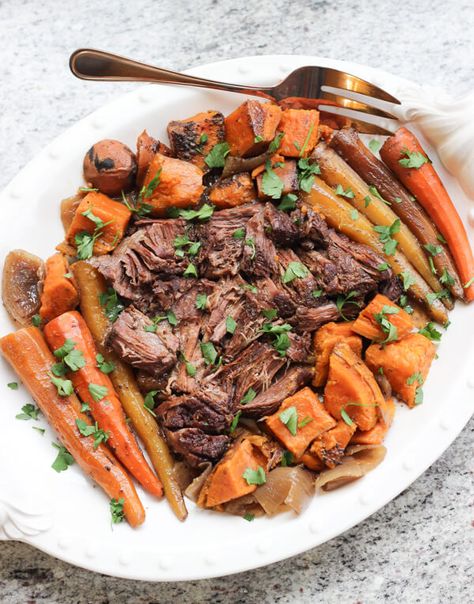 This easy slow cooker pot roast is great for a cold winter day! Red wine, whole grain mustard, and spices make the perfect gravy for this dish! Roast With Sweet Potatoes, Roast Gravy Recipe, Paleo Pot Roast, Paleo Crock Pot, Gundry Recipes, Crock Pot Sweet Potatoes, Slow Cooker Pot Roast Recipes, Slow Cooker Pot Roast, Easy Pot Roast