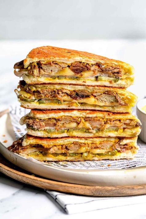 The Cuban Sandwich is the most delicious sandwich in the world, at least in our opinion. Make it with juicy pork roast, ham, cheese, gherkins and mustard. Honey Glazed Ham, Cuban Sandwich, Best Comfort Food, Delicious Sandwiches, Melted Cheese, Sandwich Recipes, Meals For One, Beautiful Food, Tray Bakes