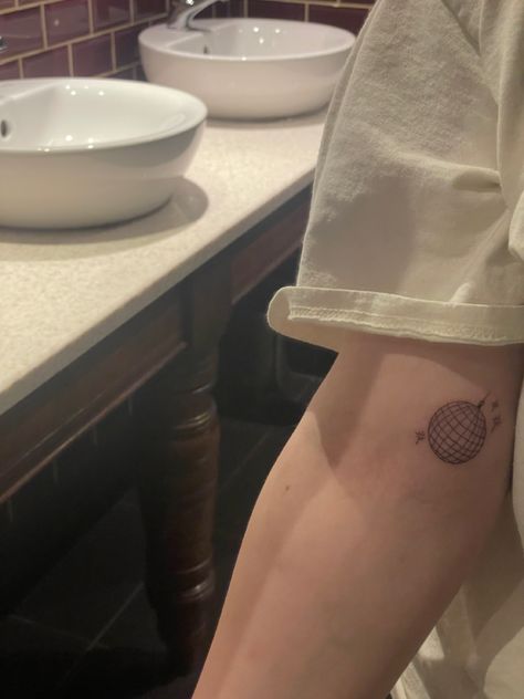 The Man Tattoo Taylor Swift, Taylor Swift Inspired Minimalist Tattoos, Taylor Swift Tattoo Ideas Small Mirrorball, Tolerate It Tattoo Taylor Swift, Mirrorball Tattoo Taylor Swift, Mirrorball Tattoo Taylor Swift Minimalist, Taylor Swift Tattoo Ideas Ttpd, Small Taylor Swift Tattoo, Mirrorball Tattoo