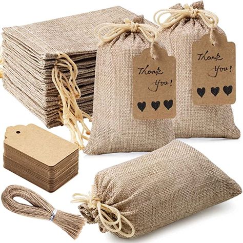 High Quality Material: These burlap gift bags are made from high quality burlap, burlap is natural and environmentally friendly, durable, washable + reusable Drawstring design, open + close easily: These burlap bags with drawstring make it easy to open + close, convenient for items storage, + can secure the contents inside well to avoid loss Perfect size: s size is about 4inch/10cm x 6inch/15cm, gift tags size 2.8inch/7cm x 1.6inch/4cm, twine length 15inch/40cm x 25 root. Mini Gift Bags, Blank Gift Tags, Burlap Gift Bags, Retail Bags, Kraf Diy, Burlap Bags, Reusable Gift Bags, Jewelry Pouches, Sack Bag