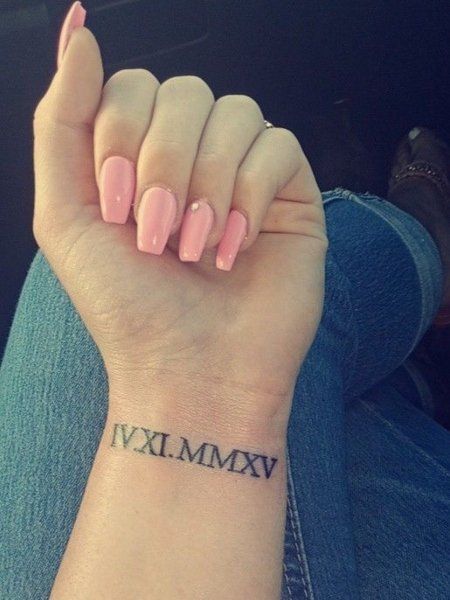 25 Cute Wrist Tattoos for Women in 2021 - The Trend Spotter Roman Numeral Wrist Tattoo, Wrist Tattoos For Girls, Tato Nama, Roman Numbers Tattoo, Inner Wrist Tattoos, Datum Tattoo, Wrist Tattoos Words, Wrist Tattoos Girls, Side Wrist Tattoos