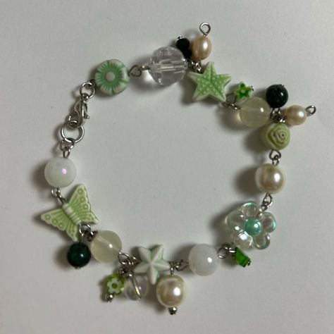 green beaded charm bracelet handmade by me (@honeybeeaded) Cute Green Jewelry, Green Beaded Bracelets Aesthetic, Green Handmade Jewelry, Green Charm Bracelet, Handmade Charm Bracelet, Beaded Charm Bracelets, Making Charm Bracelets, Beaded Charm Bracelet Ideas, Diy Charm Bracelet Ideas