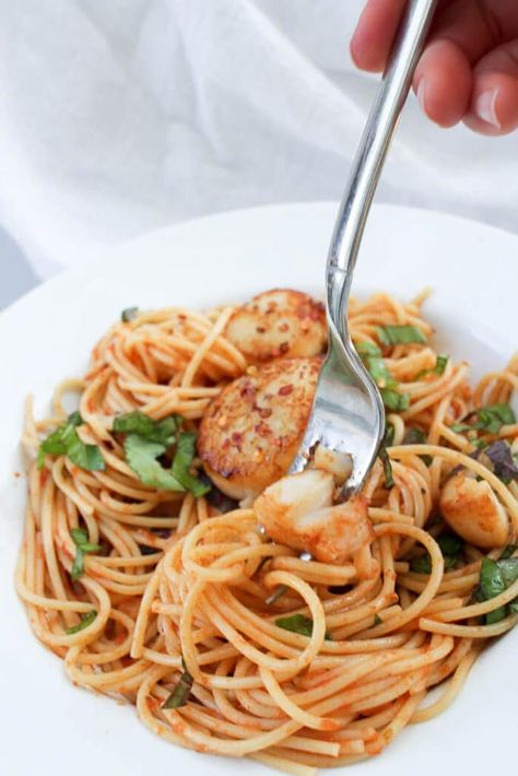 This easy recipe for scallop fra diavolo features sea scallops and pasta for an easy date night meal. This pasta is tossed in a spicy red sauce, and the scallops are seasoned with red chili pepper, for an easy seafood dinner. #seafood #seascallops #datenight #pasta Scallops With Pasta, Scallops And Pasta, Spicy Seafood Pasta, Scallop Recipes Pasta, Scallop Pasta, Red Sauce Recipe, Spicy Seafood, Fra Diavolo, Seared Fish