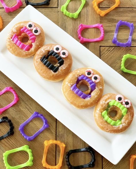 Monster Donuts - Crisp Collective Monster Donuts For Halloween, Halloween Food For Adults, Monster Snacks, School Fall Festival, Halloween Deserts, Easy Halloween Snacks, Halloween Snacks For Kids, Halloween Treat Tags, Kids Holidays