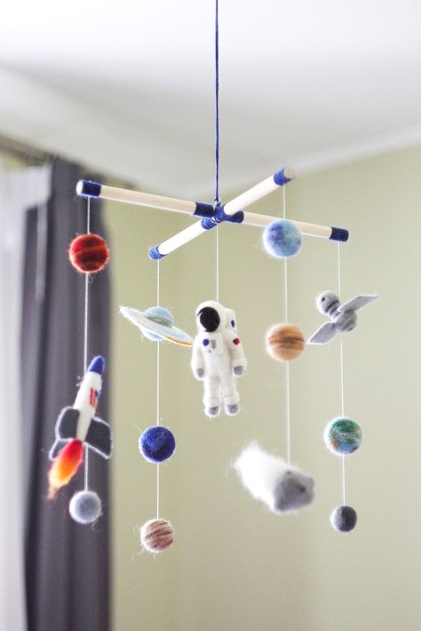 This needle felted solar system baby mobile looks very modern and will be a lovely gift for your baby. Stunning outer space mobile will become a perfect decoration for your space themed nursery decor.  This adorable rocket baby mobile includes wood frame, needle felted astronaut, nasa shuttle/rocket, asteroid, sattelite and  planets. The baby mobile felt details are made with 100% merino wool with exquisit attention to details. Multi-colored planets in muted tones will fit into almost any interi Felt Solar System, Solar System Mobile, Space Mobile, Baby Mobile Felt, Space Themed Nursery, School Zone, Cot Mobile, Space Baby, Mobile Baby