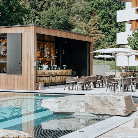 We designed a pool and a pool bar for the Atlantis hotel in Zurich. The minimalistic appearance of the pool area reflects the architecture of the Zurich swimming events from the 60s and 70s. Bar Area Outdoor, Outdoor Pool Bar Design, Swimming Pool Bar Design, Pool Restaurant Design, Hotel Pool Bar Design, Pool Cabana Bar, Hotel Pool Area Design, Pool Club Design, Pool Side Restaurant