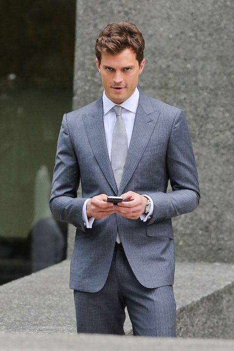 New pictures from the 50 Shades set- CosmopolitanUK Christian Gray Fifty Shades, Costume Gris, Christian Grey Jamie Dornan, A Man In A Suit, Man In A Suit, Fifty Shades Movie, Style Masculin, Fifty Shades Darker, How To Look Handsome