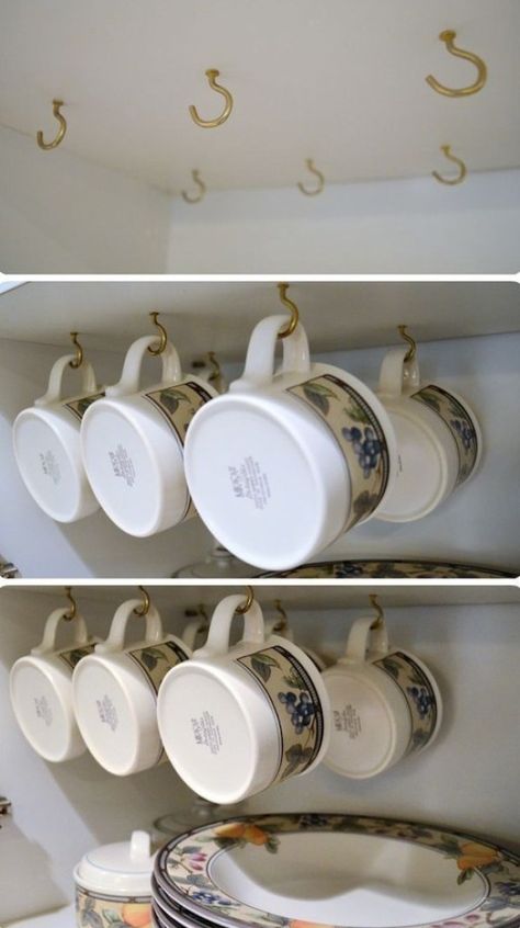 Install Hooks In The Cabinet Ceiling For Hanging Mugs - 23 Shockingly Easy DIY Kitchen Organization Ideas You Need To Try Today. If you have been looking for kitchen organization ideas then you will lose these storage ideas for your kitchen. You can use cheap dollar store items to transform your cupboards, countertops, pantry and under the sink area with these life hacks.#kitchenideas #kitchen #organisation #organization #storage Diy Kitchen Organization Ideas, Dapur Mini, Diy Kitchen Organization, Small Kitchen Decoration, Hanging Mugs, Mug Storage, Cocina Diy, Small Kitchen Cabinets, Diy Rangement