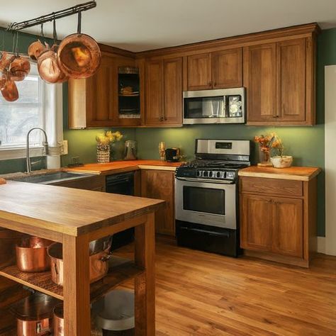 Small Kitchen Green Walls, Green Kitchen Walls With Wood Cabinets, Kitchen Interior Wall Paint Colors, Kitchen Green Walls Wood Cabinets, Earthy Kitchen Paint Colors, Green Kitchen Walls Oak Cabinets, Rustic Kitchen Paint Colors, Green Orange Kitchen, Dark Green Kitchen Walls