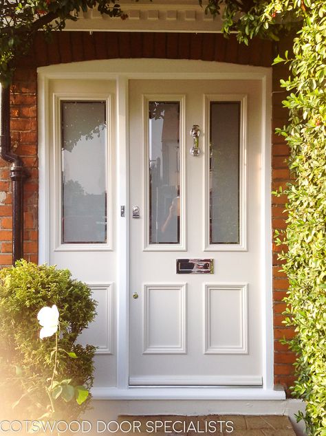 A white, Victorian front door with two etched glass panes and two panels. The glass has been sandblasted with border-less strips. The frame is made with a fixed sash side panel - Cotswood Doors Deur Makeover, Victorian Front Door, Victorian Front Doors, White Front Door, Cottage Front Doors, Front Door Inspiration, Traditional Front Doors, Composite Front Door, Front Door Styles