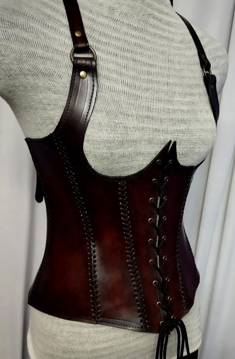 It is handmade leather Under-bust corset with hand-sewn leather detailing. It's adjustable Lace in front side and back side with buckles. We used about 2 to 2.2 mm thick handmade leather. It is hand dyed handmade leather. It is crazy for medieval events and Larp.   Corset is hand made from sturdy top-grain leather.  Bust Size is available  28 Inch to 40 inch DETAILS: ► 100% Handmade ► 100% Genuine leather ► Made on your measurements ► Unique design ► LARP standard ► Worldwide delivery Usually it Side Lacing Corset, Leather Corset Armor, Leather Armor Women, Corset Armor, Diy Goth Clothes, Steampunk Medieval, Armor Ideas, Brown Corset, Under Bust Corset