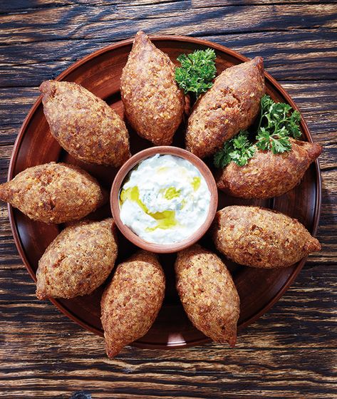 Cold potato kibbeh or kibbeh b joz (walnut kibbeh) is an easy vegetarian type of kibbeh and is served as a side. From the Food Heritage Foundation. Kibbeh Recipe, Yogurt Dipping Sauce, Meatball Dishes, Appetizer Platters, Goat Meat, Lebanese Recipes, Best Chef, Easy Vegetarian, How To Make Homemade