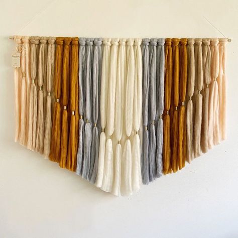 KEY DETAILS 
48"w x 1"d x 35"h. 
3 lbs. 
Wool, brass and wooden dowel. 
Hanging hardware included. 
Can only be hung horizontally. 
Sold individually. Wool Wall Hanging, Brass Detail, West Elm Kids, Yarn Wall, Woven Wall Art, Yarn Wall Hanging, Handmade Wall Hanging, Mirror Wall Art, Key Details