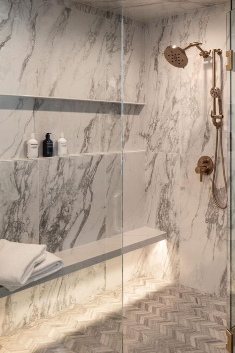 Elevate your daily routine with the epitome of luxury: a marble-encased shower adorned with opulent gold fixtures and an underlit shower bench. ✨ Immerse yourself in sophistication as you step into this lavish oasis, where every detail exudes elegance and refinement. Let the soft glow from the underlit bench envelop you in warmth as you indulge in a moment of pure relaxation. Experience the pinnacle of indulgence in your own home spa retreat. #LuxuryBathroom #MarbleShower #GoldFixtures Luxury Shower With Bench, Marble Shower Gold Fixtures, Bench In Shower Ideas, Shower Bench Ideas Built Ins, Stone Shower Bench, Steam Showers Bathroom Master Bath, Shower Bench Ideas, Shower Marble, Bathroom Bench