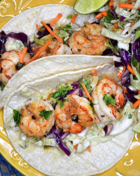 Healthy Shrimp Tacos with Cabbage Slaw is fresh, flavorful and so easy to make at home. Seasoned shrimp is grilled to perfection and topped with creamy avocado and homemade cabbage slaw that adds crunch and a tangy flavor. Easily grill the shrimp indoors or out so you can enjoy these all year long. Serve fresh shrimp tacos with Mexican rice on the side and you will have a great meal! #shrimptacos #easydinner #TacoTuesday Shrimp Tacos With Cabbage Slaw, Homemade Cabbage, Tacos With Cabbage Slaw, Healthy Shrimp Tacos, Cilantro Slaw, Seasoned Shrimp, Spicy Shrimp Tacos, Sour Cream Sauce, Healthy Shrimp