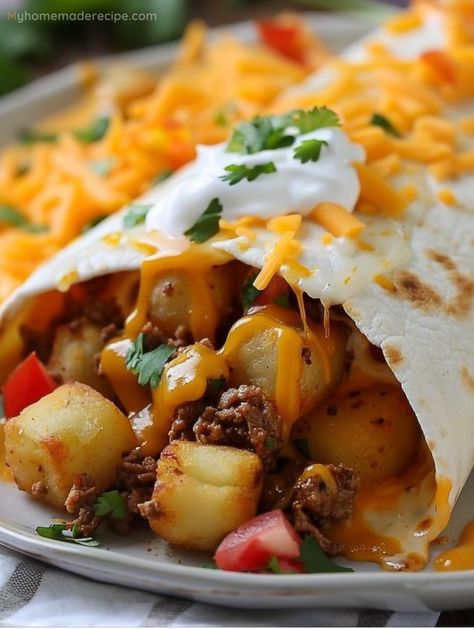 Indulge in the comforting bliss of Cheesy Potato Burritos, where golden potatoes and melting cheese unite for a symphony of flavors. It's a twist on the classic, sure to enchant! Meat And Potato Burrito, Dinner Recipes Burritos, Food Truck Potatoes, Ground Beef And Potato Burritos, Ground Beef Breakfast Burritos, Steak And Potato Burritos, Cheesy Potato Burritos, Cheesy Potato Burrito, Breakfast Burritos Potatoes