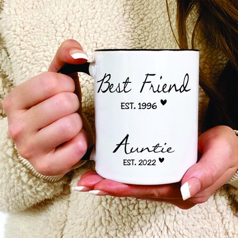 Best Friend, Auntie, Pregnancy Announcement, Custom New Aunt, New Baby Announcement, Promoted to Aunt Gift, New Aunt Gift, New Auntie Gift Details: 1. 11oz / 15oz White Ceramic Mug or 11oz / 15oz Black Handle & Rim Ceramic Mug (chosen at checkout) 2. Image is printed on both sides 3. Dishwasher (top rack) and microwave safe Our ceramic coffee mugs are made using a high quality sublimation process that adheres specialty inks to our mugs, leaving a permanent image on your mug! The images will not Auntie Pregnancy Announcement, Pregnancy Announcement Aunt, Promoted To Aunt, Unique Pregnancy Announcement, Unique Baby Announcement, New Baby Announcement, Retirement Gifts For Men, Cute Pregnancy Announcement