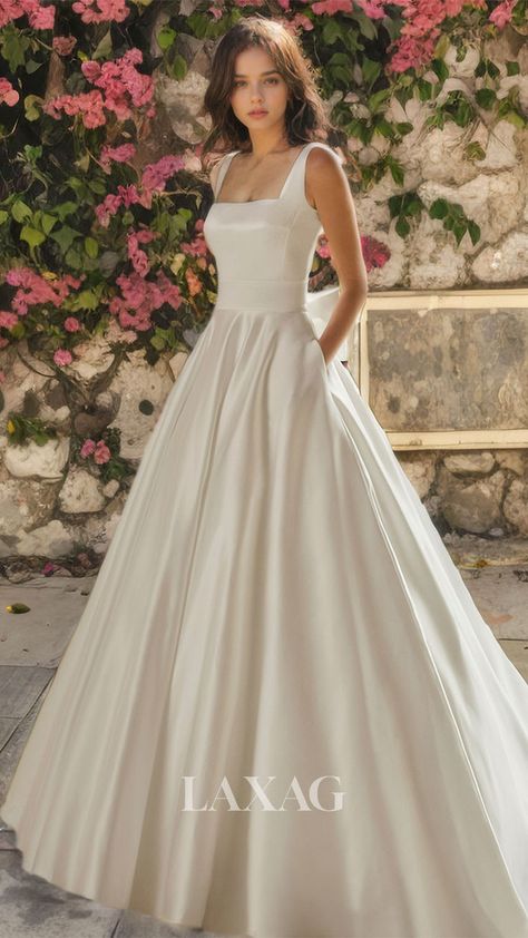 This A-line square backless wedding dress is sleek and elegant, made of high-quality satin material. The train adds a touch of glamour to the overall design. Perfect for sophisticated brides looking for a modern and chic wedding dress. Wedding Dress With Train, Chic Wedding Dresses, Dress With Train, Bow Wedding Dress, Open Back Wedding Dress, Wedding Dress With Pockets, Sophisticated Bride, Mother Wedding Dress, Back Wedding Dress