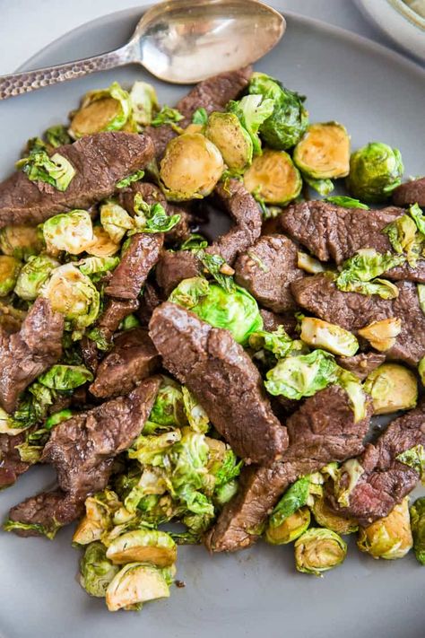 Not sure what to do with Brussels sprouts? Then look no further! Those little veggie tastes great in this beef stir fry! This is one dish that makes a great weeknight meal! It is super quick and always delivers big flavor! Steak Brussel Sprouts, Steak With Brussel Sprouts, Beef And Brussel Sprout Recipes, Steak And Brussel Sprouts, Stir Fry Brussel Sprouts, Leftover Steak Recipes, Sprouts Recipes, Steak And Broccoli, Healthy Tacos Salad