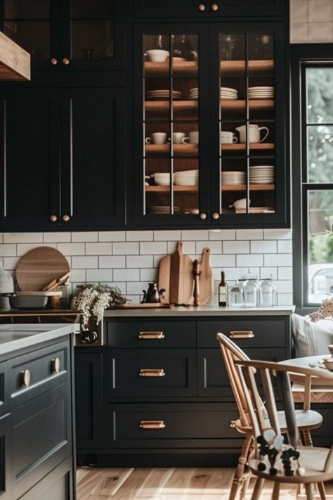 Dive into over 50 unique ideas for black kitchen cabinets, blending modern farmhouse charm with a moody yet classy and timeless style. Black Cottage Kitchen Cabinets, Black Theme Home Decor, Black Cabinets Kitchen Decor, Cottage Kitchen Black Cabinets, Black Country Kitchen, Cozy Kitchen Black Cabinets, Black Kitchen Cabinets Farmhouse, Black Rustic Cabinets, Black And Tan Kitchen