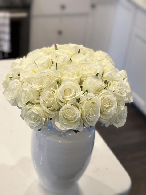 PRICES MAY VARY. Package includes 10 pieces white roses only. Artificial roses with stems size: the whole rose is about 20inch/51cm long, the diameter of the rose head is about 3.2inch/8cm. Material: Silk flowers head and leaves. Stems can be bent and cut according to your needs. Each rose has 6 artificial leaves and soft thorns distributed on the rhizome, which is more close to the real roses. Widely Used: Long stem roses can be used for many occasions. Such as weddings, party, engagements, Val Flowers White Roses, White Roses Bouquet, Fake Roses, Roses Only, Roses Valentines Day, Artificial Leaves, Roses Bouquet, Artificial Leaf, Flowers White