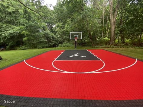 A 30x30 basketball court installed on 4 inches poured concrete base reinforced with fiber mash, the sub base was prepared with recycled concrete and compacted with a mechanical plate compactor.. Mateflex tiles were installed over a concrete slab, a combination of red tiles for the field and black borders and then the court was striped with white line for the key and the Michael Jordan Logo imprinted in the key. https://www.youtube.com/watch?v=28SO6YBXan8 Michael Jordan Logo, Basketball Court Design, Home Basketball Court, Backyard Sports, Recycled Concrete, Black Borders, Red Tiles, Jordan Logo, Synthetic Turf