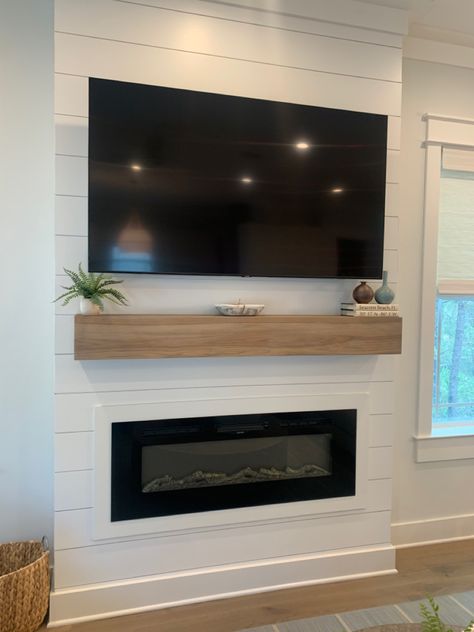 Shiplap coastal design fireplace oak mantle electric fireplace tv focal point luxury design 30A Modern Coastal Fireplace, Coastal Fireplace Ideas, Beach Fireplace, Fireplace Options, Farmhouse Reno, Coastal Fireplace, House Fireplace, Oak Mantle, Basement Finish