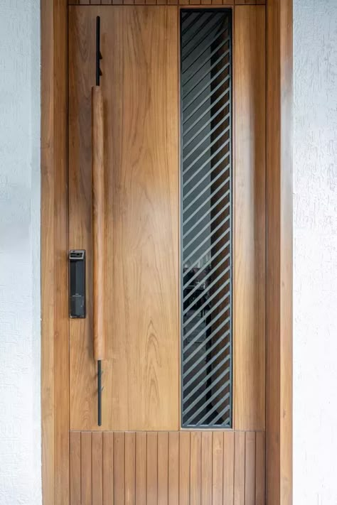 The Abstract Wall Made Of Stone Creates A Dramatic Backdrop | RD Architects Modern Entrance Door Design, Flat Entrance Design Modern, Flat Entrance Design, Main Door Designs, 2025 Aesthetic, Security Door Design, Door Design Ideas, Flush Door Design, House Main Door