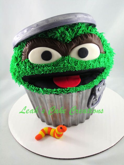 oscar the grouch giant cupcake - giant cupcake made to look like oscars garbage can.  gumpaste garbage lid, chocolate shell dusted with silver luster dust. Giant Cupcake Cakes, Big Cupcake, Sesame Street Cake, Cake Wrecks, Giant Cupcake, Cupcake Birthday Cake, Oscar The Grouch, Giant Cupcakes, Cake Central