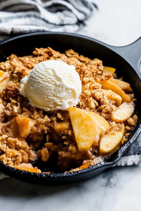 The next time you need something warm, sweet, and comforting, try this quick and easy cast iron skillet apple crisp. It’s fruity, crunchy, and to die for. Fall Skillet Desserts, Cast Iron Skillet Thanksgiving Recipes, Cast Iron Skillet Fried Apples, Apple Crisp In Cast Iron Skillet, Dutch Apple Cobbler, Cast Iron Apple Crumble, Cast Iron Skillet Apple Crisp, Cast Iron Apple Cobbler, Skillet Desserts Cast Iron