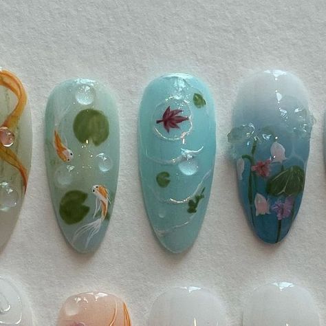 press on nails • nail design art on Instagram: "custom set ; koi pond" Coy Fish Nail Art, Water Lily Nail Art, Nails With Fish Design, Koi Nails Designs, Pond Nail Art, Lily Pad Nail Art, Fish Themed Nails, Koi Fish Nail Design, Koi Nail Art