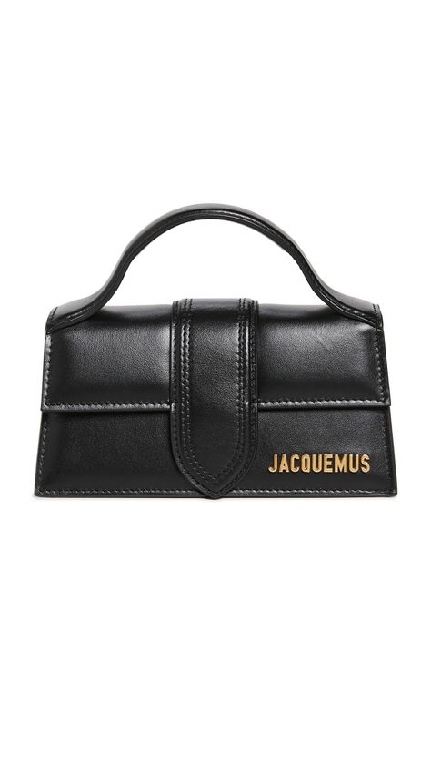 PRICES MAY VARY. Gold-tone logo emblem and hardware Length: 6.75in / 17cm, Height: 3.5in / 9cm, Strap drop: 19.25in / 49cm, Depth: 2.75in / 7cm Fold-over flap with magnetic snap Optional, adjustable strap Lined Another of Jacquemus's ever-covetable micro bags, the Bambino is crafted from smooth leather and designed with a simple fold-over top and gold-tone logo lettering. Mini Designer Bags, Micro Bags, Jacquemus Bag, Logo Emblem, Gold Bag, Luxury Purses, Black Clutch, Black Purses, Cute Bags