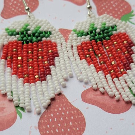 Sparkly summer fruit earrings. Strawberry fringe. Red and white with gold and green. Original design by Handmade Seed Beaded. Strawberry Bead Earrings, Strawberry Seed Bead Earrings, Beaded Animal Earrings, Summer Beaded Earrings, Strawberry Beaded Earrings, Beaded Strawberry Earrings, Beaded Strawberry, Indigenous Beading, Sellable Crafts