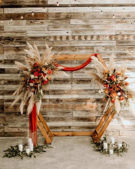 Florist: Thistle & Vine (Ider, AL) Venue: The Venue at Lily Lou’s (Trenton, GA) . #pampas #boho #arbor #bohoarbor #pampasarbor #hexagonarbor #hexagon #wild #wedding #weddingarbor #weddinginspiration #weddingflowers #weddingflorist #natural Terracotta Arbor Wedding, Rust Boho Wedding Flowers, Hexagon Wedding Arch Flowers Fall, Boho Fall Wedding Arbor, Boho Wedding Hexagon Arch, Burnt Orange Wedding Alter, Hexagon Wedding Arch Terracotta, Hexagon Arch Fall Wedding, Hexagon Wedding Arch Flowers Boho