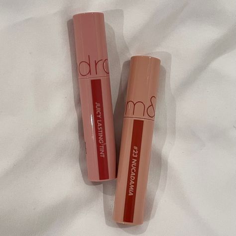 rom&nd juicy lasting tints from the bare juicy series in shade 25 bare grape on the left and shade 23 nucadamia on the right Romand Lip Tint Nucadamia, Romand Lip Tint Fig Fig, Nucadamia Rom&nd, Romand Juicy Lasting Tint Nucadamia, Romand Lip Tint Bare Grape, Romand Juicy Lasting Tint Bare Grape, Rom&nd Lip Tint, Romand Lip Tint, Bare Grape