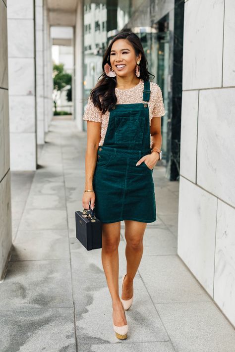 Hoang-Kim wears a green corduroy overall dress with a blush sequin t-shirt Green Corduroy Dress Outfit, Corduroy Skirt Overalls, Overall Dress Outfit, Womens Corduroy Overall Dress, Green Courderoy Overall Dress, Courdory Overalls Dress, Corduroy Dress Outfit, Corduroy Overall Dress Maternity, Corduroy Overall Dress