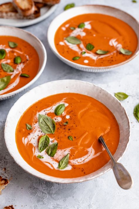 Creamy vegan tomato soup using canned tomatoes and delicious coconut milk to give it the perfect texture and a hint of sweetness. This comforting, easy vegan tomato soup recipe gets a wonderful boost of flavor from caramelized onions and is the perfect lunch or dinner with your favorite crackers, garlic toast and anything your heart desires. #veganrecipe #tomatosoup #vegansoup #coconutmilk #plantbased #dairyfree #healthylunch #healthydinner Souper Bowl, Vegan Tomato Soup, Garlic Toast, Canned Tomatoes, Ambitious Kitchen, Seasoning Salt, Tomato Soup Recipes, Cooking With Olive Oil, Perfect Lunch