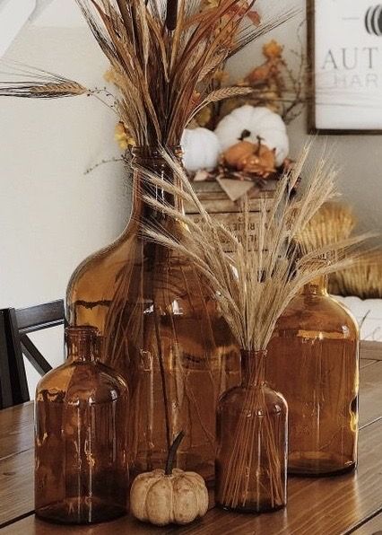 Thanksgiving Vase Centerpieces, Decorating With Brown Glass Bottles, Amber Bottle Fall Decor, Brown Jug Decor, Fall Decor With Amber Bottles, Amber Vase Decor, Brown Bottle Decor, Amber Vases Wedding Centerpieces, Glass Jugs Decor Ideas