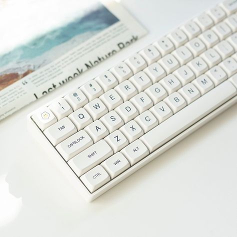 Please accept this white minimalism. Different from the cliche black, this white is clear, natural, fresh, and clean. It is undoubtedly an excellent match for typing or gaming, allowing you to isolate all impurities and focus on this moment on the keyboard only. #minimalist #white #keycap #keycaps #keycapset #mechkeyboard #mechkeyboards #officelife #officespace #officedecor #pcsetup #gamingsetup #gamingsetups #gamingsetupidea #keyboard #keycapss