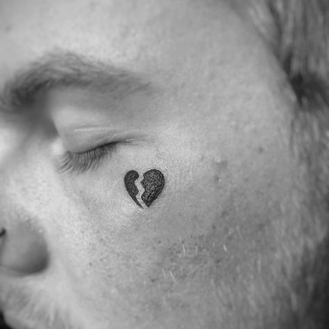 Small Face Tattoo Men Under Eye, Under Eye Tattoo, A Heart Tattoo, Eye Tattoo Meaning, Black Heart Tattoos, Love Heart Tattoo, Small Wave Tattoo, Face Tats, Tiny Heart Tattoos