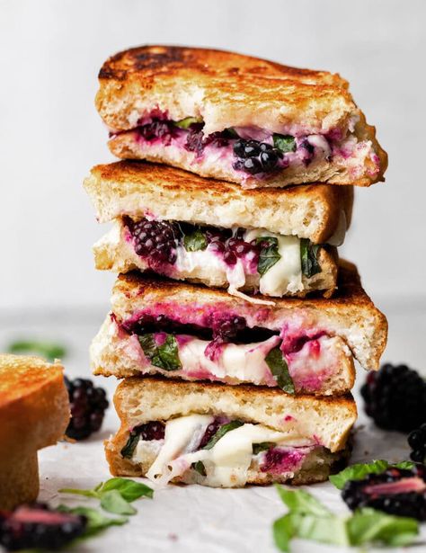 Blackberry Caprese Grilled Cheese - Step up your grilled cheese sandwich game with this delicious caprese inspired blackberry grilled cheese sandwich. This isn’t your classic grilled cheese, but it’s an amazing melt style twist on a favorite! Fresh blackberries, goat cheese, mozzarella, and fresh basil are piled on sourdough bread and grilled to perfection. Great for a quick and easy lunch or dinner. Includes how-to photos and plenty of notes! Vegetarian. Blackberry Grilled Cheese, Basil Grilled Cheese, Easy Savory Recipes, Easy Sliders, Cheesy Sandwich, Perfect Burger, Grilled Sandwiches, Grill Cheese Sandwich Recipes, Best Sandwich Recipes